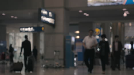 People-and-air-crew-in-airport-hall