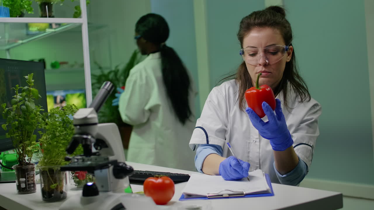 Biologist woman examining pepper writing microbiology medical expertise