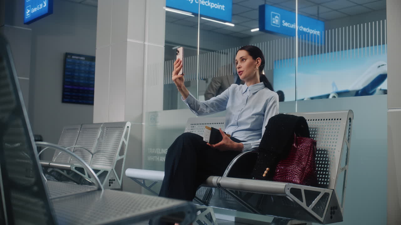 Businesswoman Taking a Selfie in Airport Waiting Area