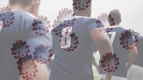 animación de la interfaz digital con la célula del virus covid 19 sobre jugadores de rugby