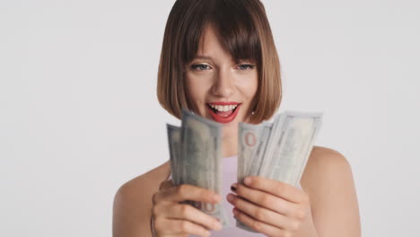 wealthy woman smiling and counting banknotes