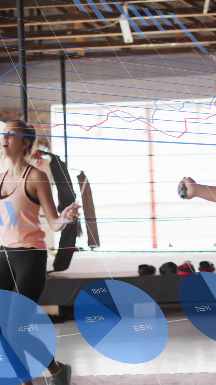 Jumping rope in gym, fitness data and charts animation over athletes