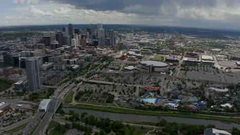 downtown denver aerial drone cinematic south platte river elitch gardens ball arena du mscd cityscape colorado cars traffic parking lot nuggets avalanche broncos spring summer circling left movement