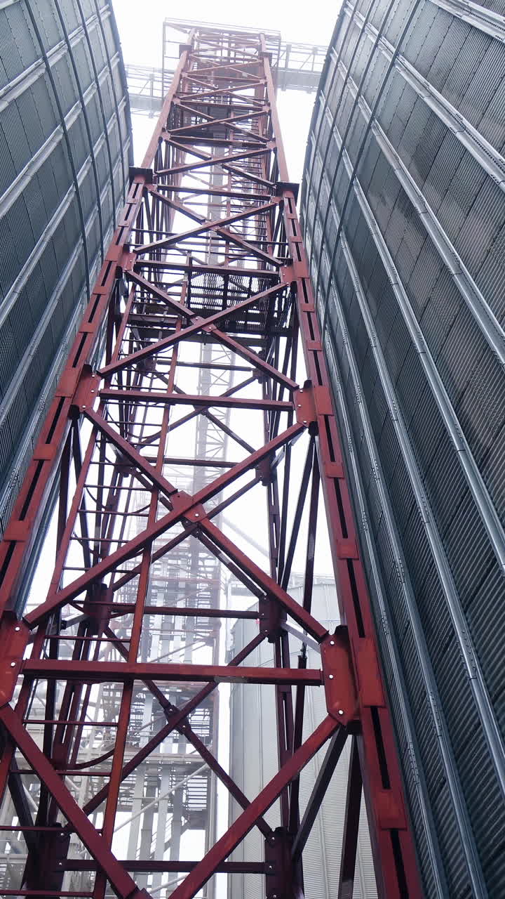 Large gray tanks for grain. Large gray metal tanks for storage of grain