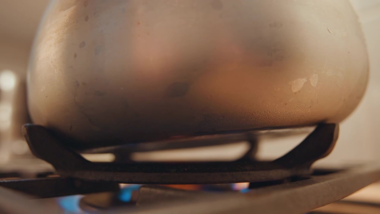 Vapor from boiling. Steam results when water heats and boils. Boiling causes water to turn into vapor and produce steam. Heating water in kettle results in vaporization and formation of steam