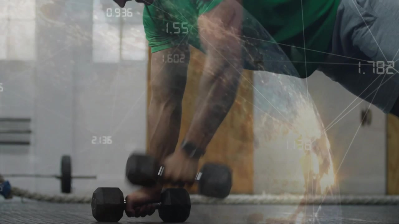 Man adjusting wrist grip for balance lowering, pressing dumbbells in gym with globe data shifting