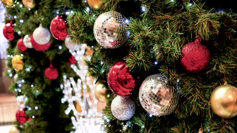 white snowflake colourful glittering baubles ornament ball decorated christmas tree. holiday winter xmas happy new year festival decoration. snowflake ball on christmas tree. merry christmas decorate