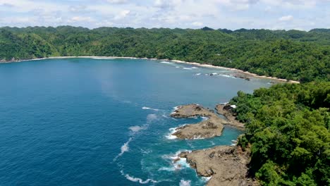 Idyllic-tropical-lagoon-and-Wediombo-beach,-Wonosari,-Indonesia,-aerial-view