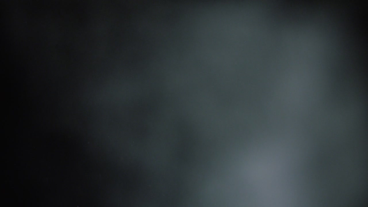 fondo abstracto oscuro con partículas de polvo