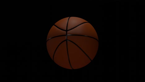 basketball ball rotating on black background. sports equipment, loop-able spinning ball, suitable for video overlays. basketball games concept