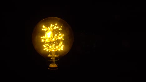 bright ideas light bulb invention or idea concept . symbol of idea. the light comes on on a black background