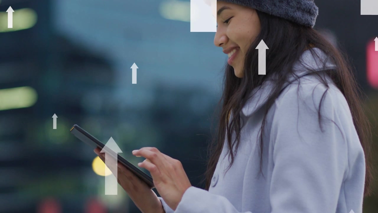 Woman tapping tablet by city railing causing tech arrows showing gains while camera revealing smile