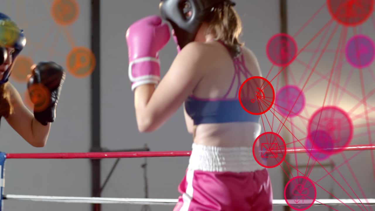 Right boxer throwing jabs, left defending slipping, pink overlay over right during boxing drill