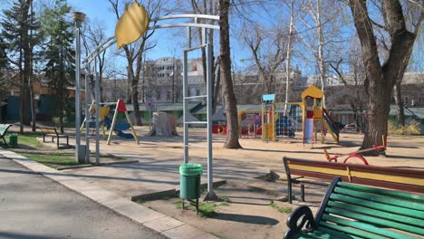 empty children playground in cathedral square park in the center of chisinau, moldova during state of emergency by the reason of covid-19 virus threat