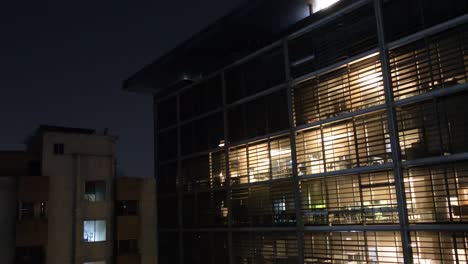 modern building at night with illuminated windows