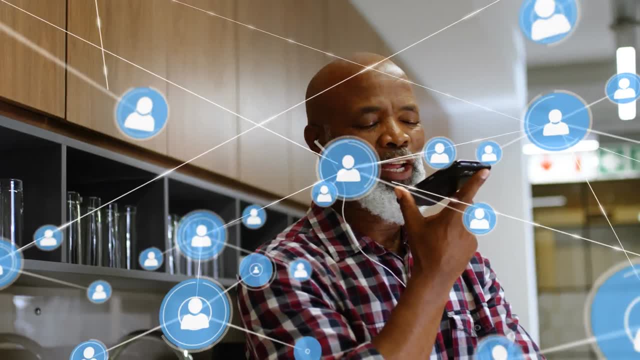 Animation of network of connections with icons over businessman using smartphone