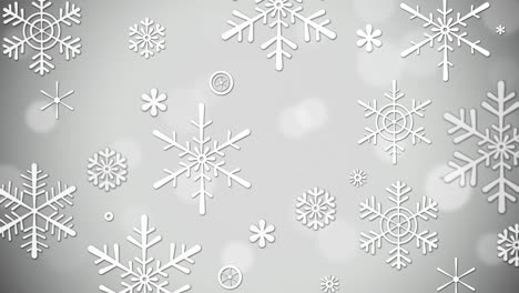 brillo brillante con copos de nieve congelados en un fondo gris y plateado con bokeh. fondo de navidad de invierno de bucle, feliz navidad y vacaciones de año nuevo. animación 4k