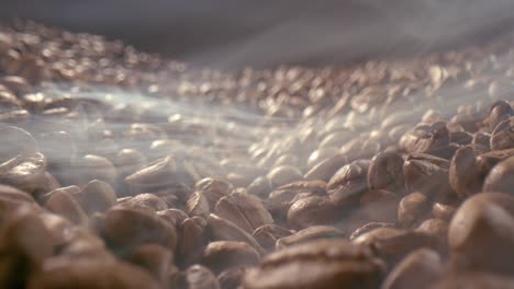 close up of seeds of coffee. fragrant coffee beans are roasted smoke comes from coffee beans.