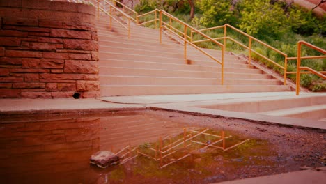 puddle and rock formation at red rocks amphitheatre