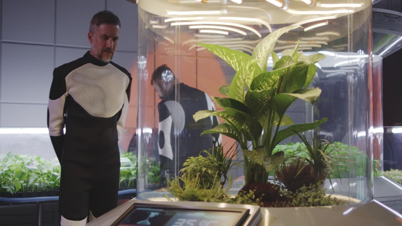 Space Greenhouse - Astronaut Examining Plants
