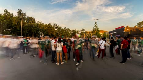 spectators and football fans out of the stadium after the match,time lapse