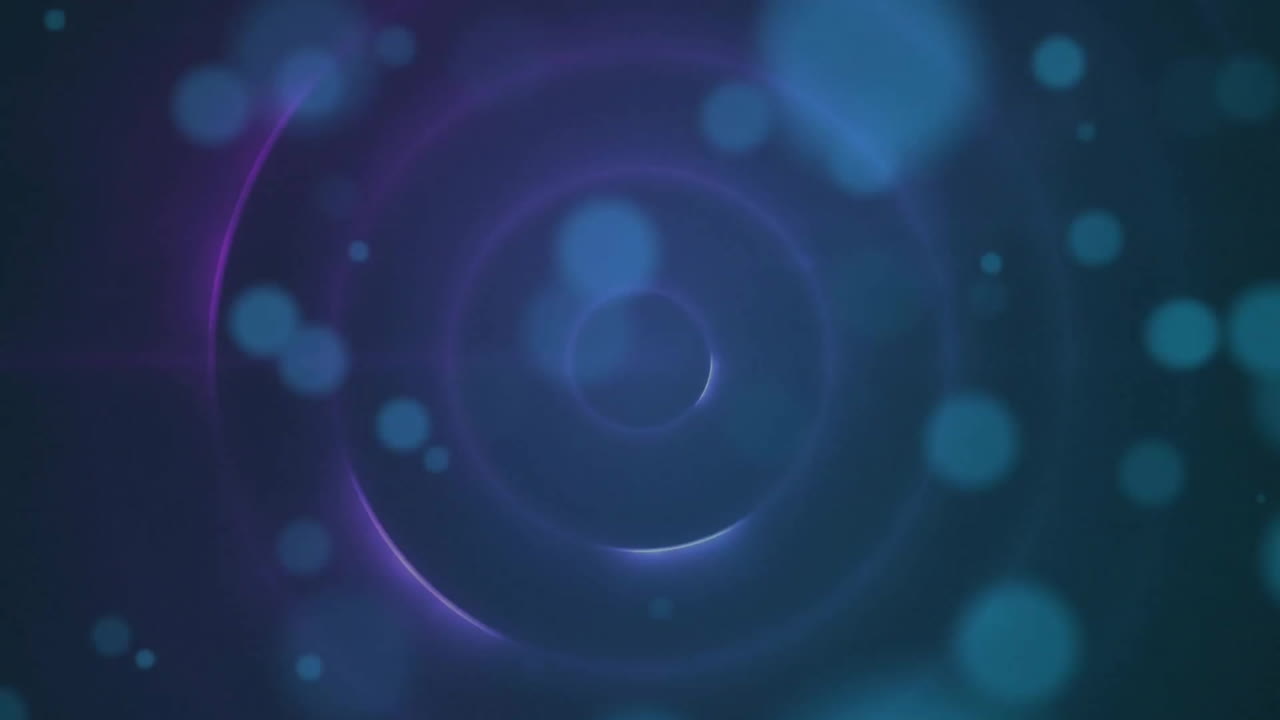 Animation of blue spots and circles moving on black background