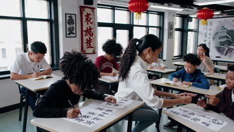 asian students learning chinese calligraphy