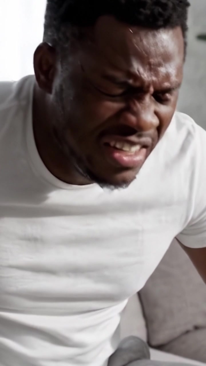 Man Struggling with Back Pain: A Powerful Depiction of Discomfort and Distress in Everyday Life, Highlighting the Challenges Faced in Daily Activities and Mobility.