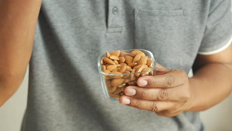 person eating almonds