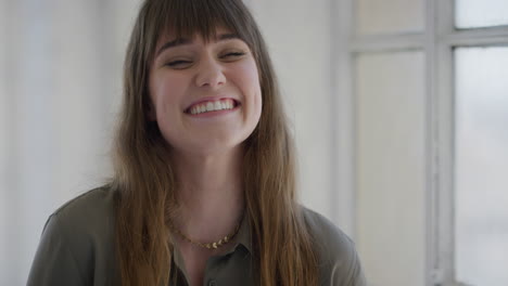 portrait of beautiful young woman laughing cheerful satisfaction looking at camera positive caucasian happy female expressing gentle individual slow motion