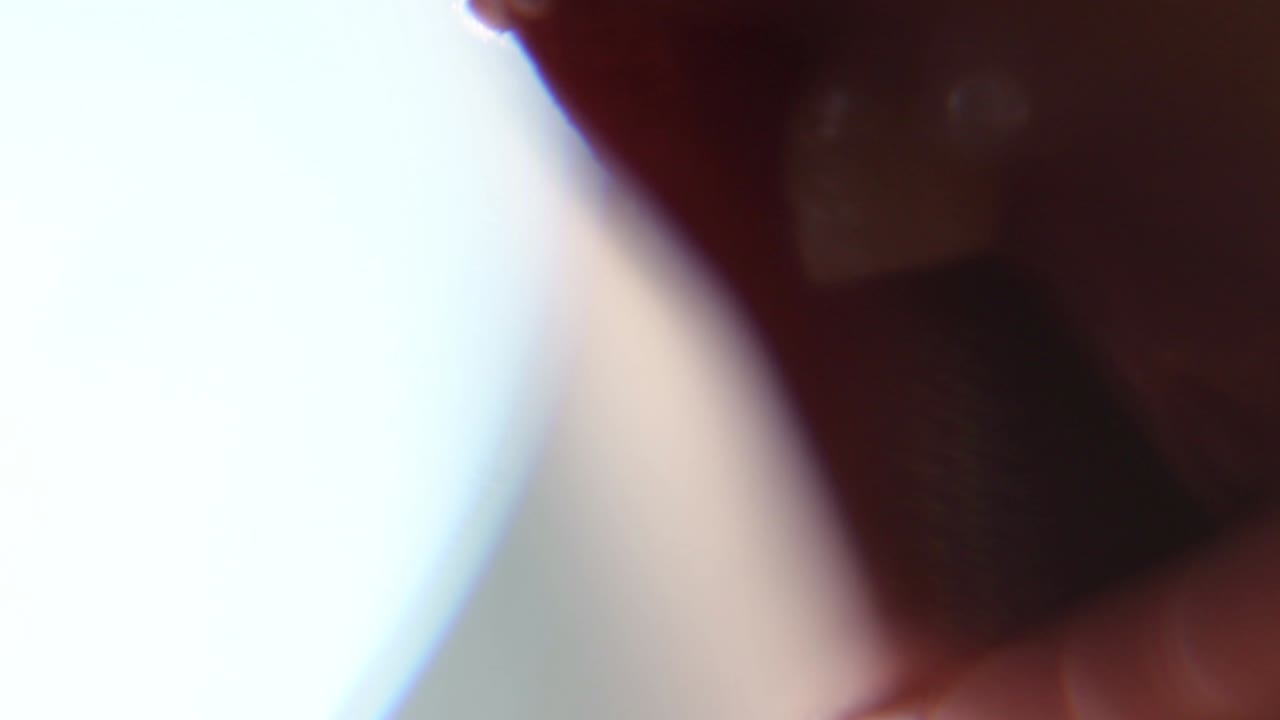 Macro Close Up Of Child Girl Wiggling Loose Teeth