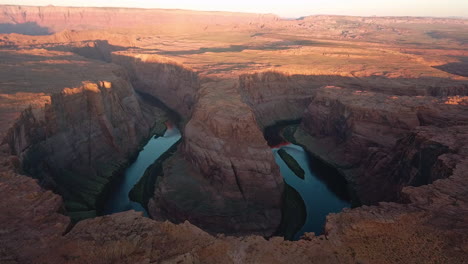 sunrise light slowly falling on horseshoe bend,colorado river,arizona