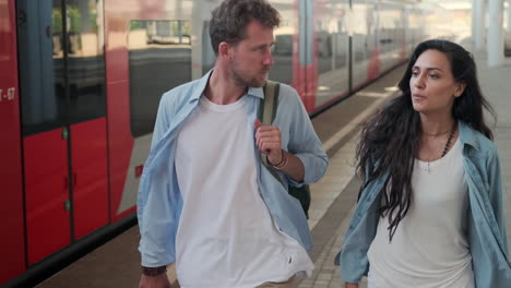 couple walking at train station