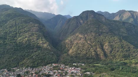 aerial view of mountains and some city in italy from a drone