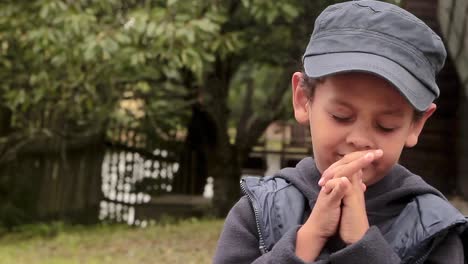 little boy praying to god with hands together stock footage-1