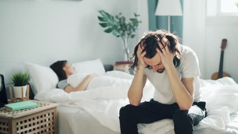 couple arguing in bedroom