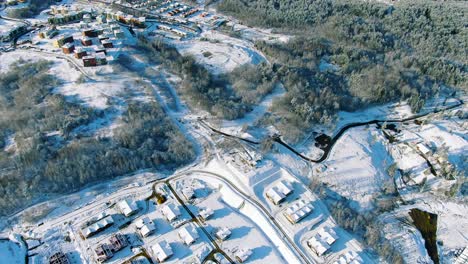 aerial view of a snowy residential construction site