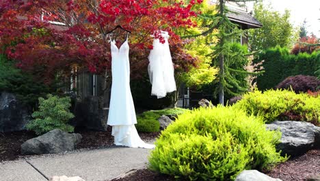 aerial drone captures the ethereal beauty of a white wedding dress in a scenic outdoor setting, revealing the anticipation and excitement before the unforgettable ceremony