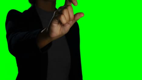 Woman-making-hand-gesture-against-green-screen-background