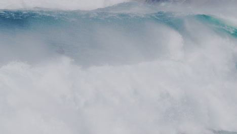 close-up of crashing waves on the sydney coastline, with water mist and turbulent sea action.