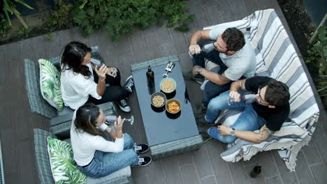 friends clinking glasses with red wine and drinking