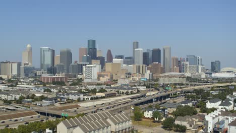 establishing drone view of clear blue sky over downtown houston, texas