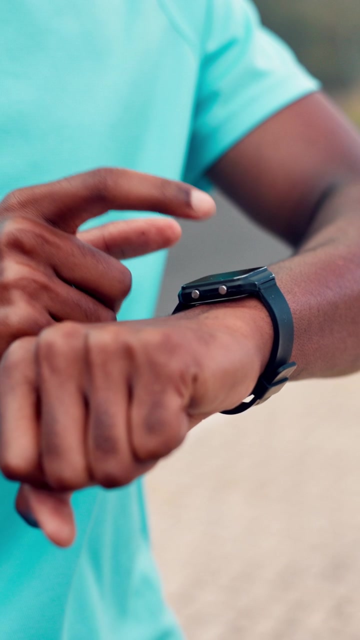 Athlete Checking Smartwatch During Outdoor Workout