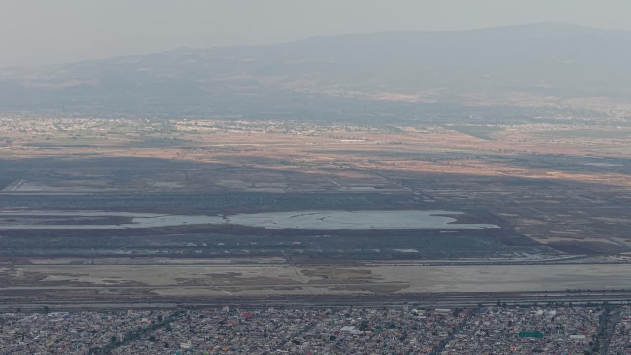 Aerial flight over northern Mexico City and State of Mexico, showcasing NAIM Texcoco