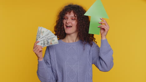 happy woman winner holding arrow sign pointing up, career growth and money dollar exchange increase