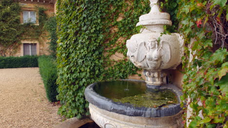 a stone water fountain in a courtyard