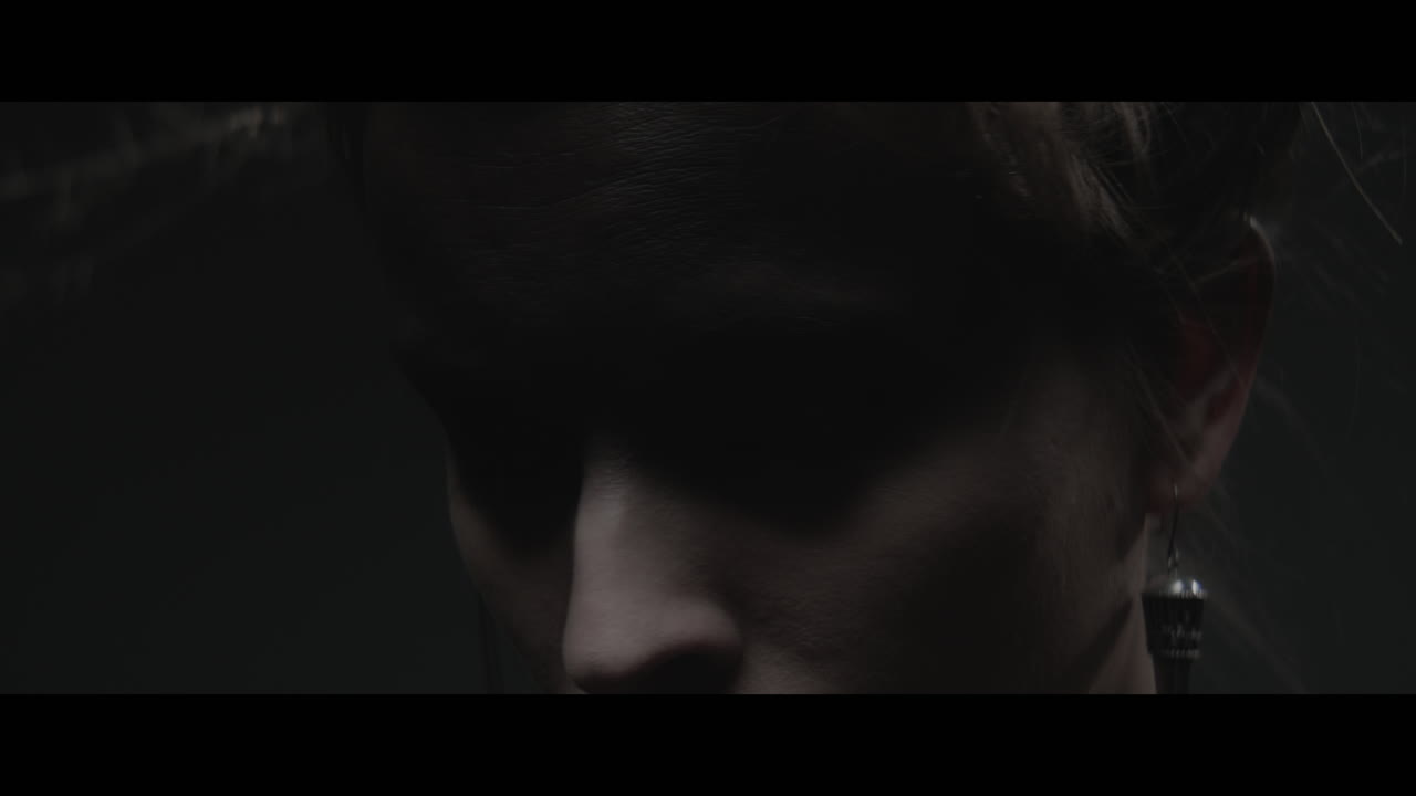 A woman dressed as mother nature turns her head and look into the camera