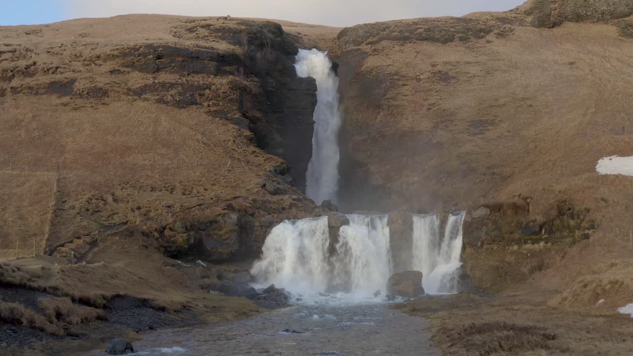 Slow Aerial Approach Large Icelandic Waterfall