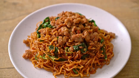 stir-fried instant noodles with thai basil and minced pork - asian food style