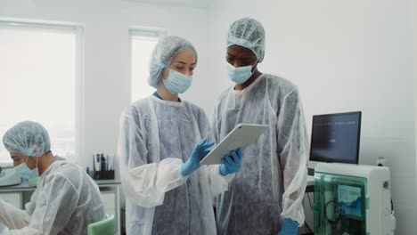 medical professionals reviewing data in a laboratory setting